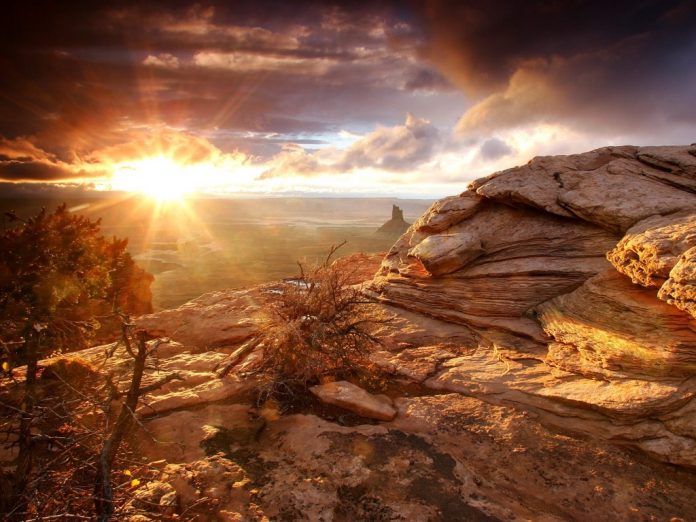 a photo of desert with sun shine